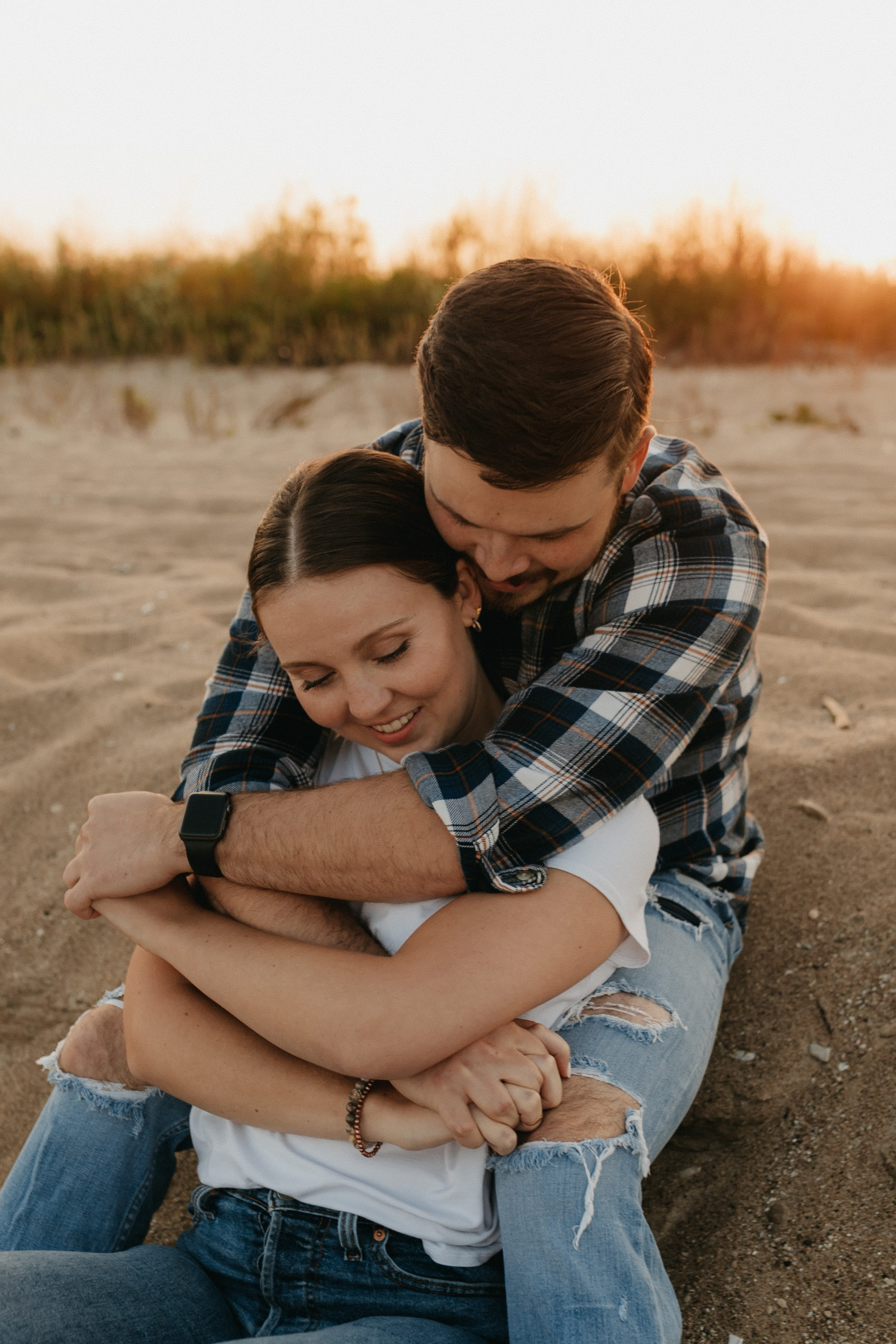 Couple embracing on a sandy beach