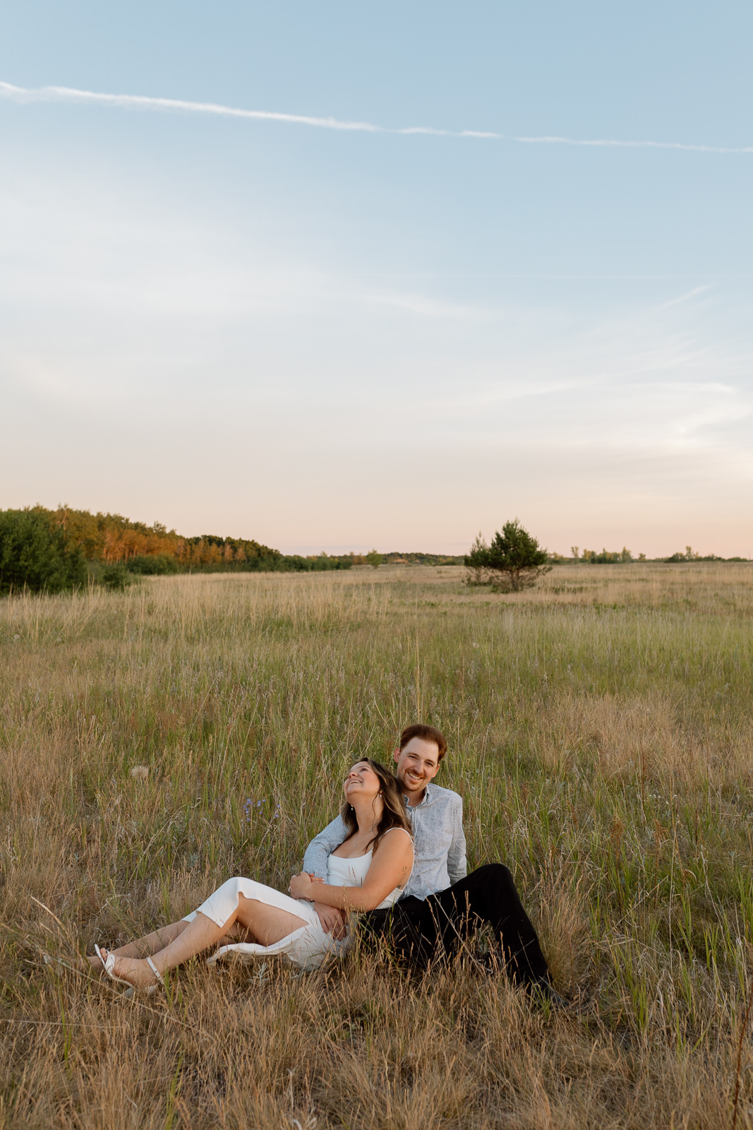 Man & Woman laughing in a field