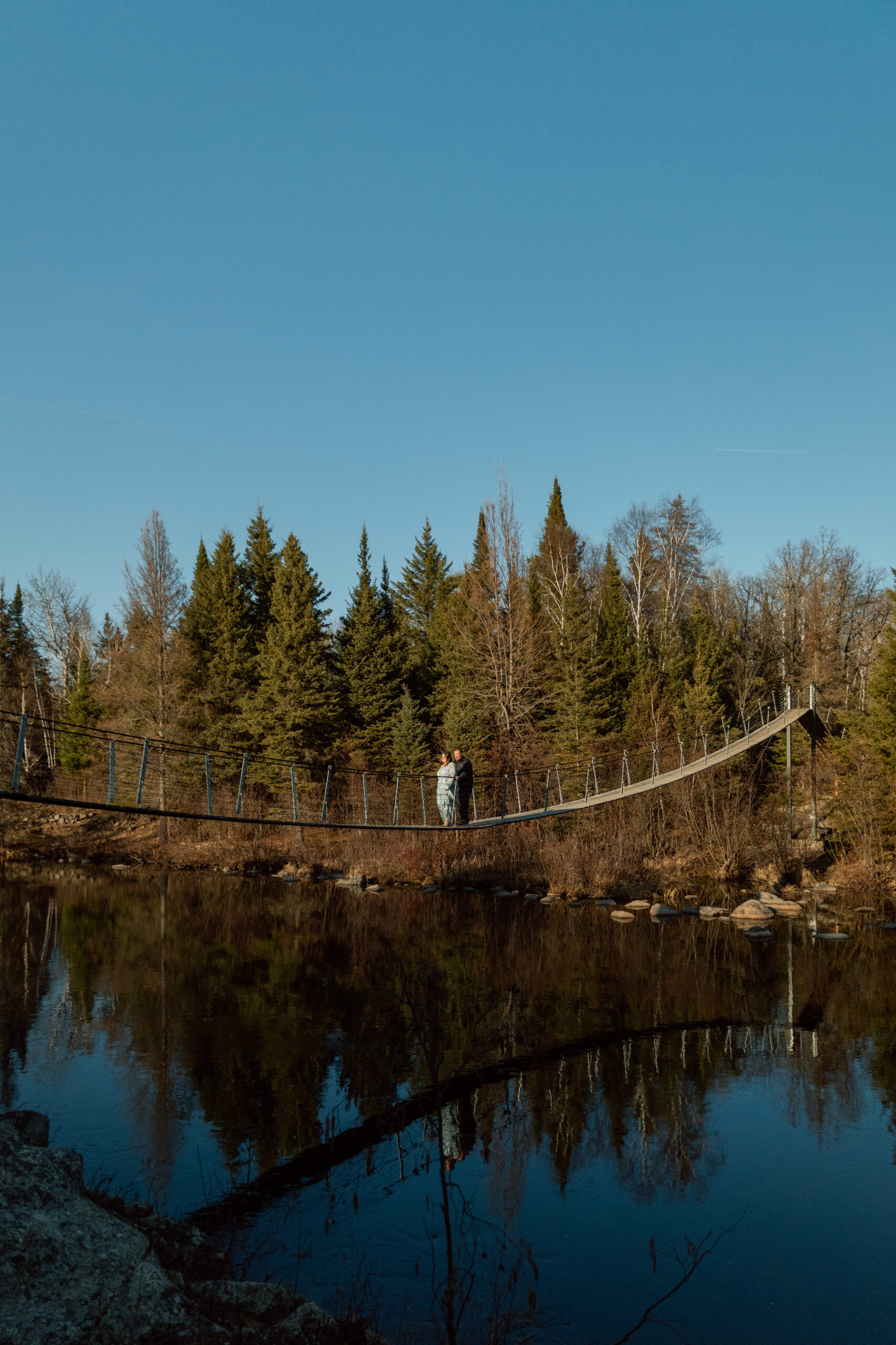 Couple on a swing bridge