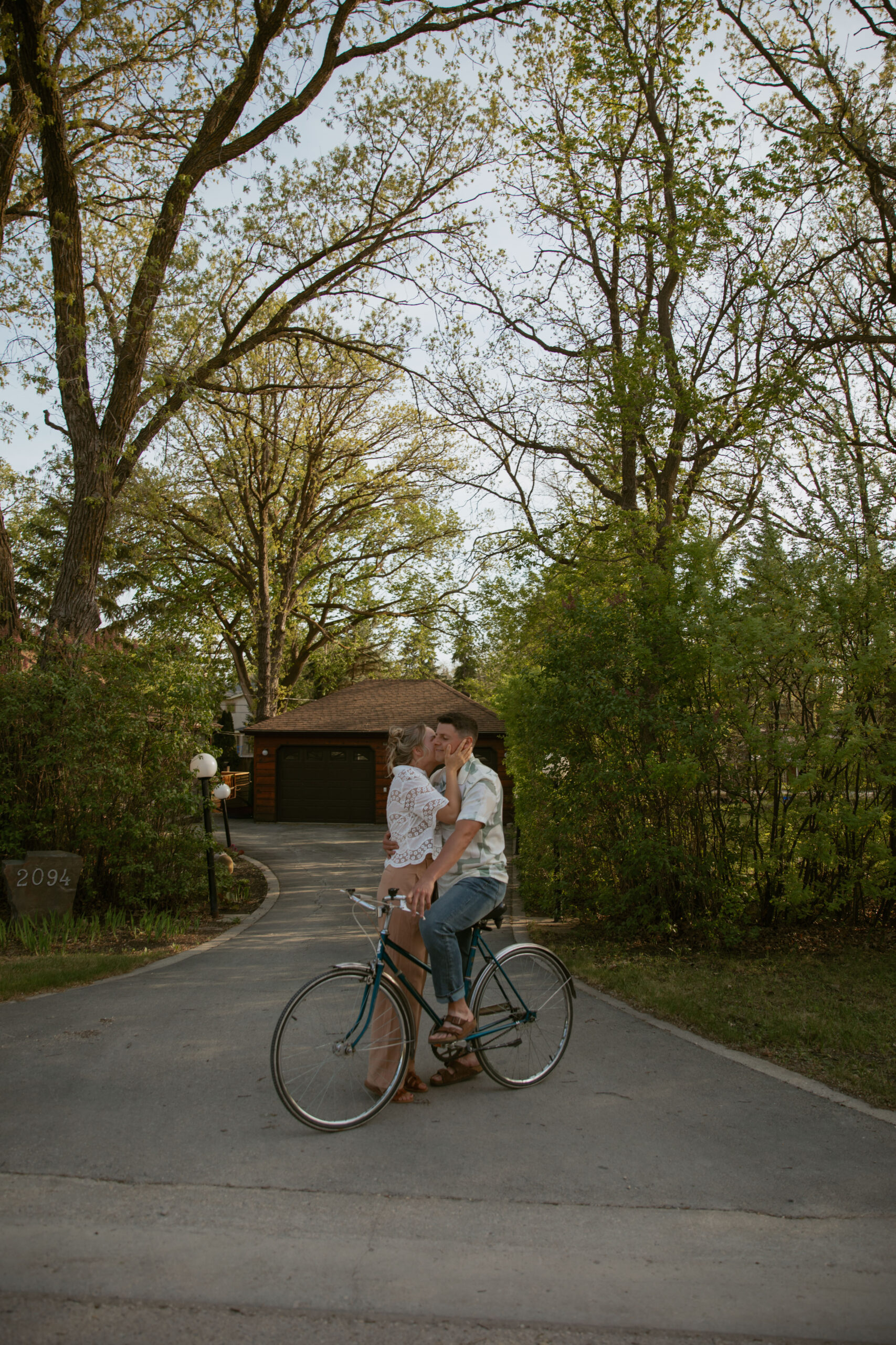Couple kissing on a bike