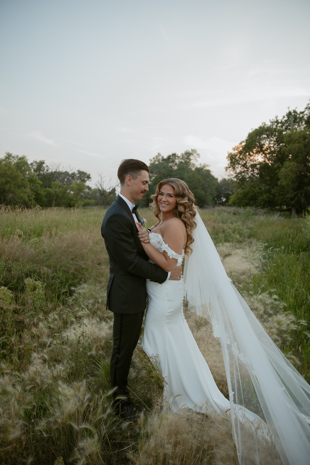 Bride & Groom at sunset in field of foxtails